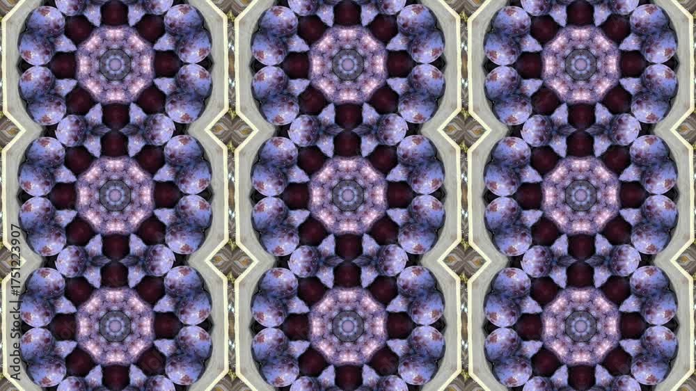 A repeating kaleidoscopic pattern featuring floral motifs in shades of purple and gold