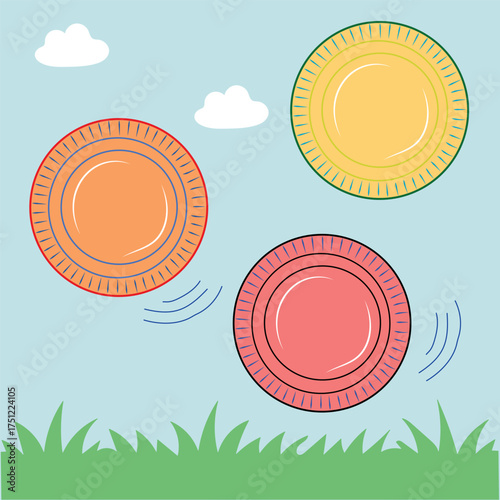 Colorful frisbees flying high across clear blue sky