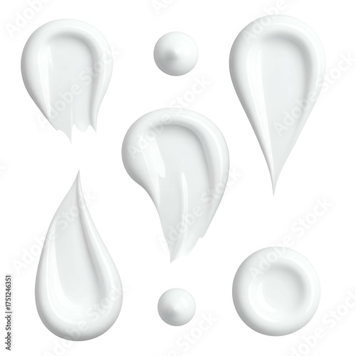 Close-up of various white cream smears & dots, isolated on a black background