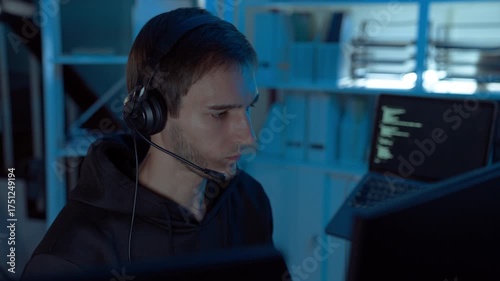 IT support specialist wearing headset assisting remote clients in dark office, representing communication, reliability, and expertise in modern digital service and technology support.