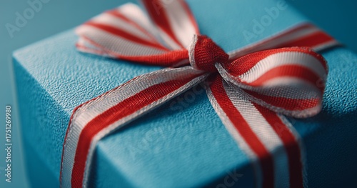 Gift Box With a Red and White Ribbon on a Dark Background Ready for Celebration