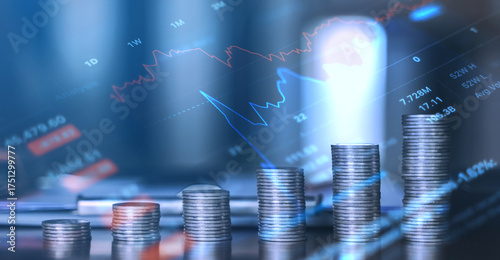 Several stacks of coins with floating financial charts, symbolizing investment growth, savings, and economic trends in fintech.