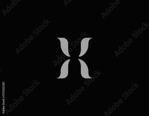 This image presents a contemporary and minimalist silver 'X' symbol, representing a mix of elegance and modernism, ideal for branding purposes and visual impact.