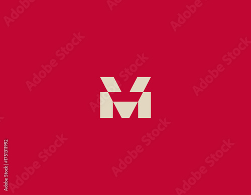 A distinctive logo featuring the letter M in a bold design, showcasing modern aesthetics with sharp lines and a vibrant red background for strong visual impact.