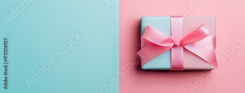 Gift Box Wrapped in Blue and Pink Ribbon on Pastel Background