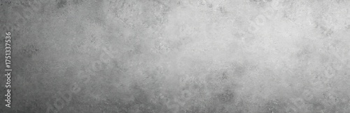 Neutral gray stone concrete texture background panorama. Abstract weathered surface with light spots. Minimalist backdrop for design projects.