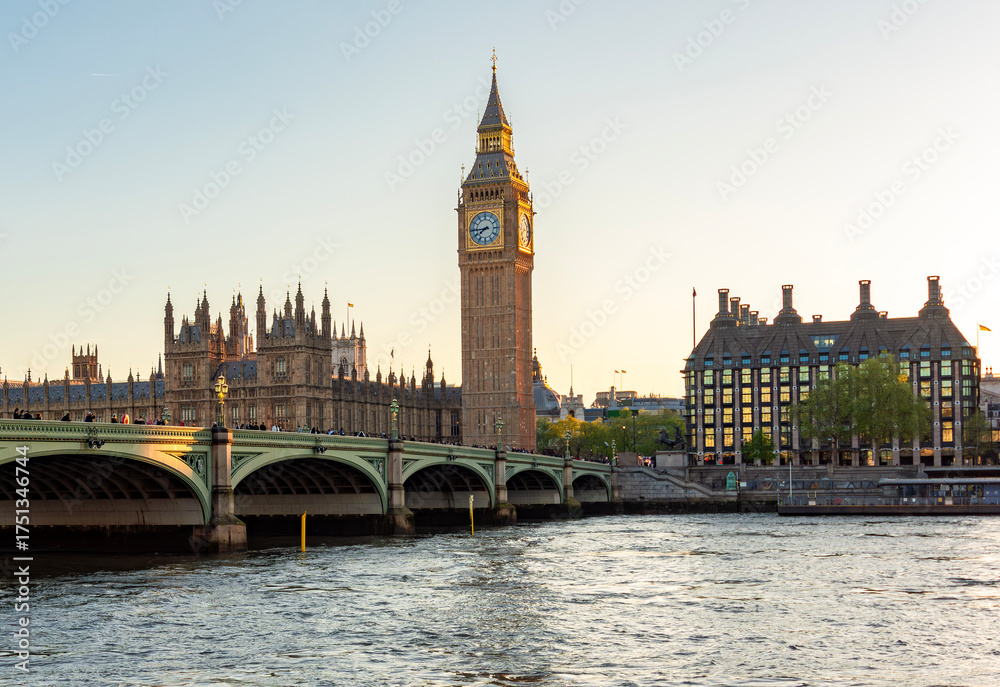 Naklejka premium Houses of Parliament with Big Ben tower and Westminster bridge at sunset, London, UK
