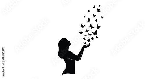 Silhouette of a woman releasing a swarm of butterflies into the air, symbolizing freedom and dreams.