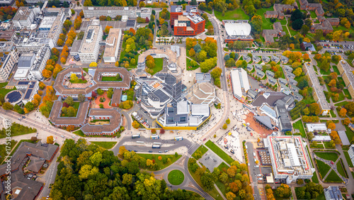 Photos Aerial view of the University of Warwick campus surrounded by trees in autumn co