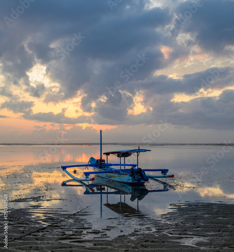 Bali Indonesian Traditional Jukung Outrigger Boat at Sunrise 