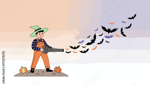 Playful boy in witch hat blows bats with a blower creating a festive Halloween scene