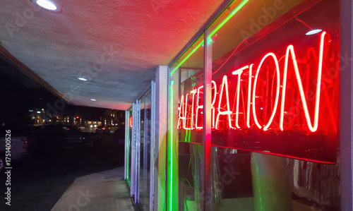 A Red Neon Alterations Sign