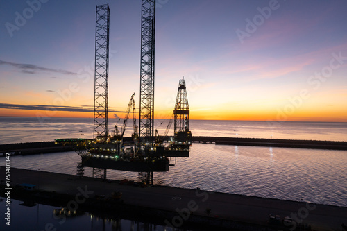Wallpaper Mural Aerial view of offshore jack up rig in a shipyard during sunset for oil and gas exploration and production. Torontodigital.ca