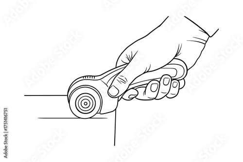 Hand using rotary cutter to cut fabric. Crafting tool for fabric, sewing and quilting.