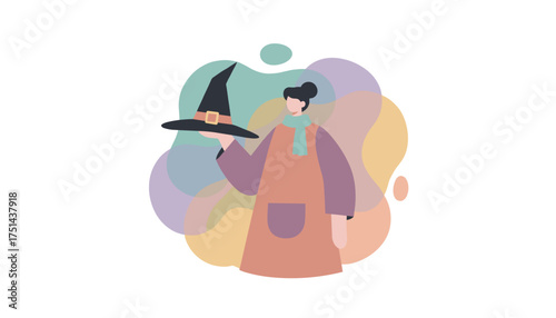 Woman holding a witch hat ready for Halloween festivities or a creative autumn celebration