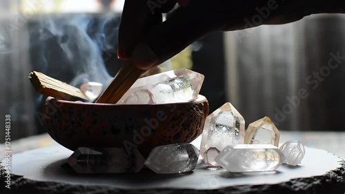 Close Up Shot of Crystal Healing with Palo Santo in Textured Background Featuring Smoke Brown Bowl and Hand Spiritual Wellness and Alternative Therapy Practice Featuring Relaxation