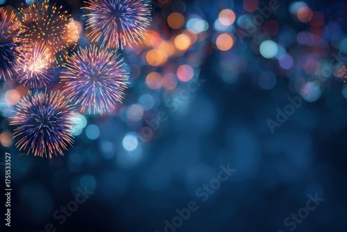 Fireworks display against a dark blue background with bokeh