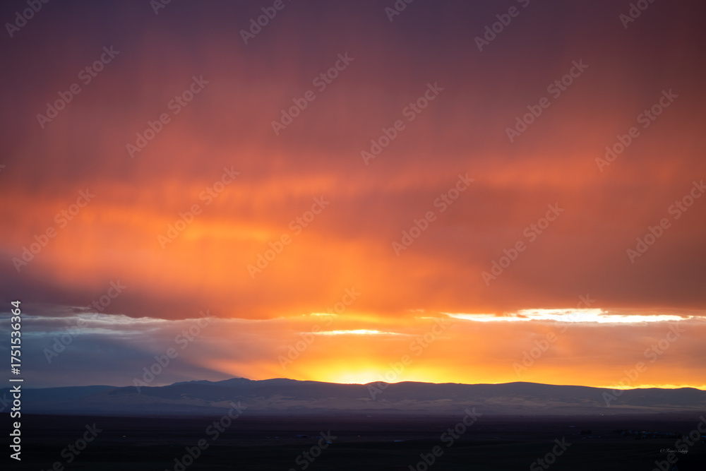 Fototapeta premium Windy red sunset dramatic clouds in Wyoming 