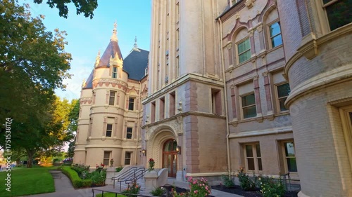 A beautiful scenic view of the Spokane County Courthouse, bathed in the soft, warm light of sunrise