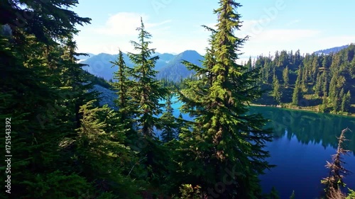 A breathtaking view of the vibrant blue waters of Lake Valhalla, nestled amidst the stunning wilderness of Washington and part of the iconic Pacific Crest Trail