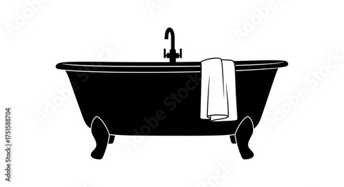 Elegant Clawfoot Bathtub with Towel and Faucet.