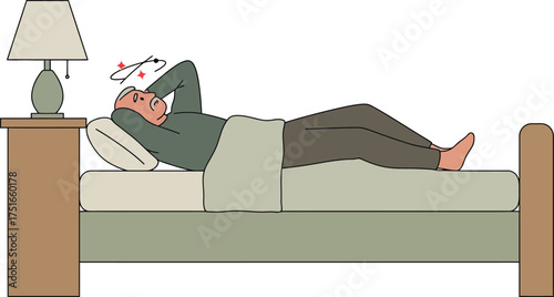 Elderly man experiencing dizziness or vertigo while resting in bed at home