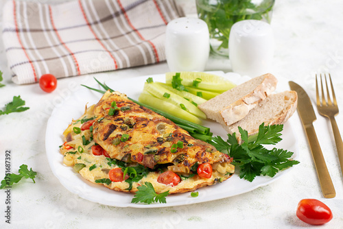 Omelet with vegetables and herbs. Healthy breakfast.