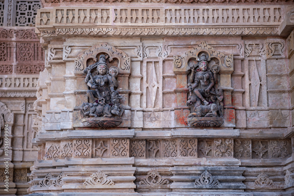 Fototapeta premium Twin Black Goddess Stone Sculptures on Shamlaji Temple Wall, Modasa, Gujarat, India