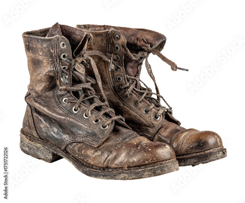Worn work boots, dark brown leather, heavily soiled, laced and tied.  Leather shows significant signs of use and age.  Durable construction,  evident from the soles and stitching. 