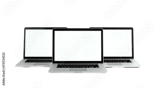 Three laptops, arranged in a row with blank screens, against a stark black background