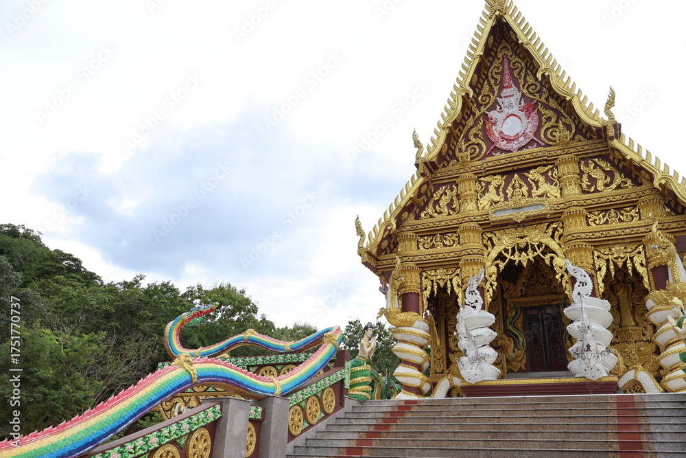 Naklejka premium Two Thai temples in the same frame, one more elaborate than the other