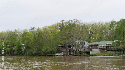 Waterfront homes and docks along the riverbank in Southern Louisiana Wetlands, USA