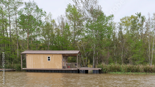 View of the waterfront house and dock along the riverbank in Southern Louisiana Wetlands, Louisiana, USA