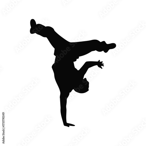 Silhouette of breakdancer performing an athletic handstand pose with dynamic motion
