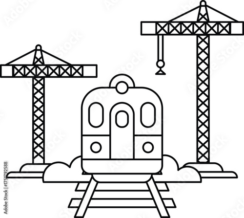 A train is on a track next to two cranes
