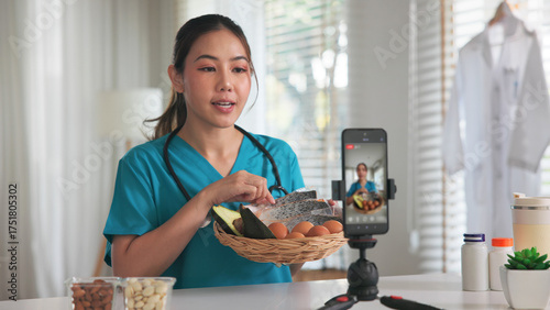 Asia woman people anti aging expert modern health care vlogger live advice talk selfie video mobile phone camera. Online diet food weight loss HDL meal plan recipe digital virtual asian coach filming.