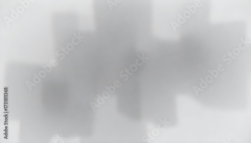 Abstract blurred composition of gray and white shapes, creating a soft, undefined pattern.