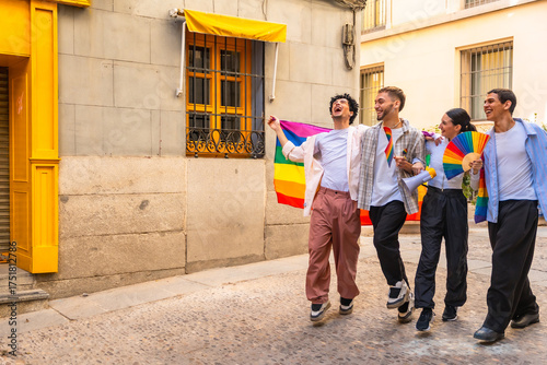 Happy queer people celebrating lgbtq pride on street