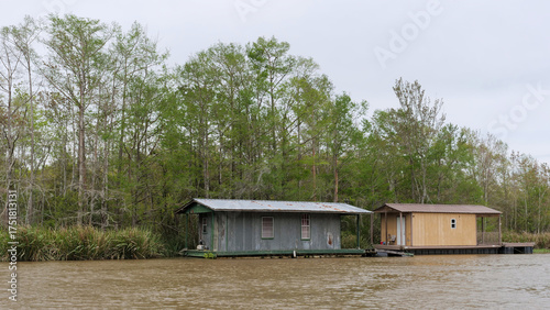 Waterfront homes and docks along the riverbank in Southern Louisiana Wetlands, Louisiana, USA