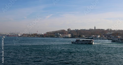 Calm spring view of Istanbul’s Historic Peninsula with gentle waves and ferry traffic on a clear day. 4K UHD.