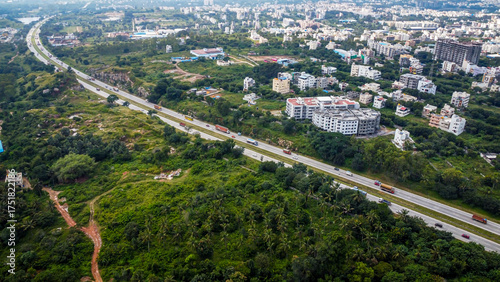 Arial shot of Beautiful road infrastructure of karnataka in India. Aerial view city traffic Highway road with car vehicle movement in Bangalore.