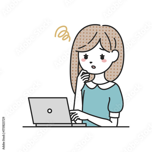 パソコンの前で悩む女性