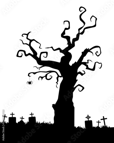 Silhouette of a creepy tree in a cemetery.