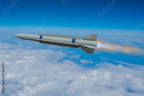 Fotografi A hypersonic missile flies at high altitude above the clouds, leaving behind a bright jet trail