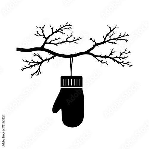 Hanging mitten on a tree branch evokes cozy winter vibes, warmth, and the calm of snowy days.
