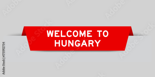 Red color inserted label with word welcome to hungary on gray background