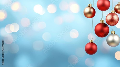 Hanging Red, Gold, and Silver Christmas Ornaments on a Light Blue Background with Bokeh Lights.