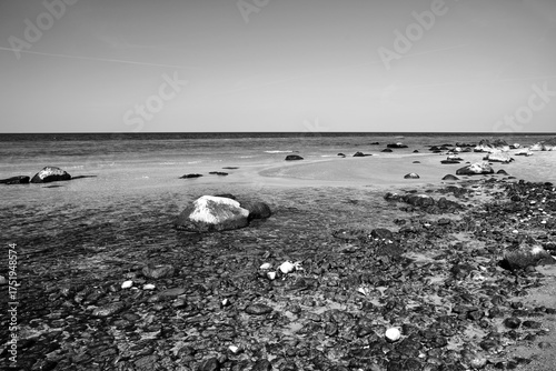Fototapeta Naklejka Na Ścianę i Meble -  Boulders on a pebble beach by the Baltic Sea on the island of Wolin