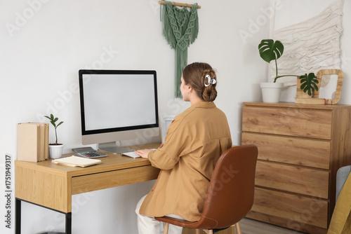 Young woman working with bl...
