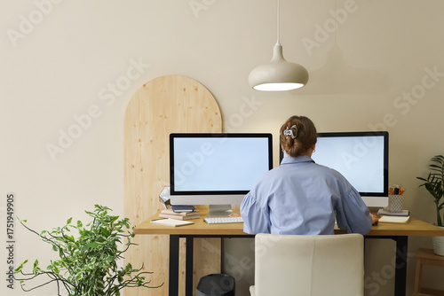 Young woman working with co...